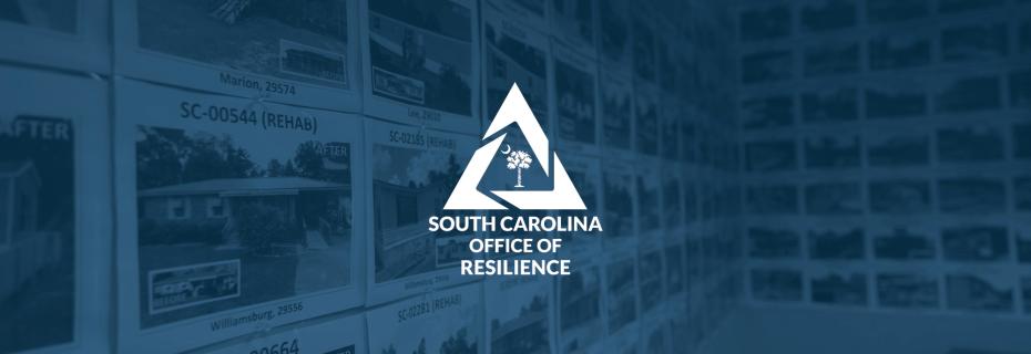 Photographs of repaired and rebuilt houses hanging on a conference room wall with the SC Office of Resilience logo overlayed