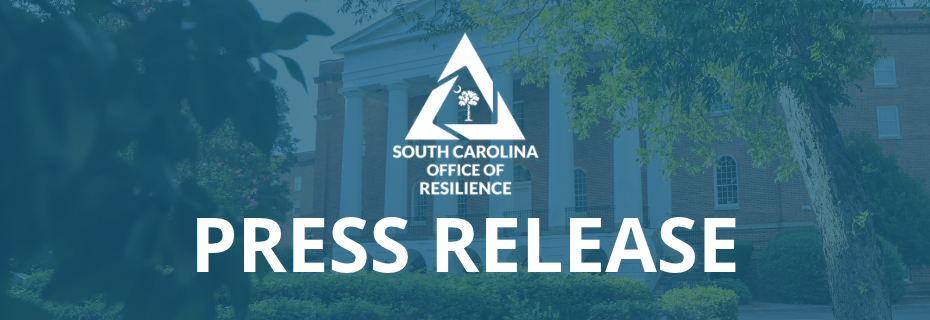 SCOR Logo and the words Press Release overlayed on a blue tinted background of a four story brick building with white columns and surrounded by trees.